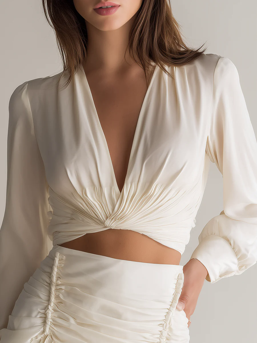 Simple And Elegant V-Neck Long Sleeve Top And Smocked Tassel Skirt Set